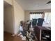 View of the living room needing TLC but with lots of natural light and good layout at 1905 Meridel Ave, Tampa, FL 33612