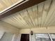 View of the porch ceiling showing some staining and a mounted light fixture near the front door at 1905 Meridel Ave, Tampa, FL 33612