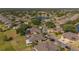 Aerial view of a well-maintained community with lake, showcasing the home's location and neighborhood appeal at 2007 Acadia Greens Dr # 0, Sun City Center, FL 33573