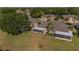 Scenic aerial view of the home showcasing its large backyard, screened lanai, and proximity to a lush green space at 2007 Acadia Greens Dr # 0, Sun City Center, FL 33573