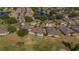 Serene aerial view of houses nestled beside a golf course and placid waterways, in a beautiful residential area at 2007 Acadia Greens Dr # 0, Sun City Center, FL 33573