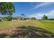 Expansive backyard featuring a screened lanai with an attractive view of the golf course at 2007 Acadia Greens Dr # 0, Sun City Center, FL 33573