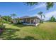 Great view of the screened lanai and pristine lawn overlooking the golf course, perfect for outdoor living at 2007 Acadia Greens Dr # 0, Sun City Center, FL 33573