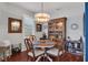 Inviting dining area with a chandelier and natural light, perfect for Gathering meals at 2007 Acadia Greens Dr # 0, Sun City Center, FL 33573