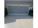Garage with screen and well manicured plants at 2007 Acadia Greens Dr # 0, Sun City Center, FL 33573