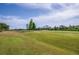 Expansive golf course landscape under a bright sky, showcasing lush green fairways and distant trees at 2007 Acadia Greens Dr # 0, Sun City Center, FL 33573