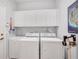 Functional laundry room equipped with modern appliances and ample storage at 2007 Acadia Greens Dr # 0, Sun City Center, FL 33573