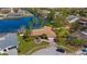 Stunning waterfront home with mature landscaping, private dock, and lovely curb appeal at 2142 Ibis, Clearwater, FL 33764