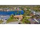 Aerial view of a canal-front home with tropical landscaping, a pool, and a private boat dock at 2142 Ibis, Clearwater, FL 33764