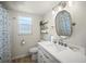 Bright bathroom with updated fixtures, shelving, and stylish decor at 2142 Ibis, Clearwater, FL 33764