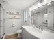 Bathroom featuring a modern vanity, glass shower, and updated fixtures at 2142 Ibis, Clearwater, FL 33764