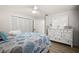 Bedroom with hardwood floors, a large dresser, and a coastal themed comforter at 2142 Ibis, Clearwater, FL 33764