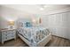 Bright and airy bedroom with coastal decor, ceiling fan, and light wood floors at 2142 Ibis, Clearwater, FL 33764