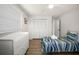 Well-lit bedroom with wood floors, closet space, and a single bed at 2142 Ibis, Clearwater, FL 33764