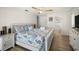 Spacious bedroom with ensuite bathroom features seaside themed decor at 2142 Ibis, Clearwater, FL 33764
