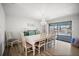 Elegant dining room with a chandelier and views of the outdoor pool area at 2142 Ibis, Clearwater, FL 33764