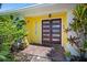 Charming entrance showcasing double doors, brick pathway, and a bright, welcoming exterior at 2142 Ibis, Clearwater, FL 33764
