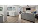Open-concept living room with waterfront views, wood flooring, and modern furnishings at 2142 Ibis, Clearwater, FL 33764