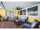 Screened patio with ample seating offering indoor/outdoor living at 2142 Ibis, Clearwater, FL 33764