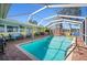 The pool is surrounded by patio furniture, providing ample lounging space at 2142 Ibis, Clearwater, FL 33764