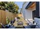 Private backyard oasis with fire pit, patio chairs, and a new wooden fence at 2150 43Rd N Ter, St Petersburg, FL 33714