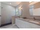 Modern bathroom with double vanity, dual sinks, walk-in shower, and contemporary lighting at 2150 43Rd N Ter, St Petersburg, FL 33714