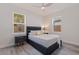 Modern bedroom featuring a sleek platform bed and stylish bedside tables with lamps at 2150 43Rd N Ter, St Petersburg, FL 33714
