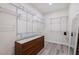 Walk-in closet with built-in shelving, gray wood-look floors, and storage space at 2150 43Rd N Ter, St Petersburg, FL 33714