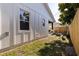 A view of the home's exterior showcasing the siding, windows, and a glimpse of the backyard at 2150 43Rd N Ter, St Petersburg, FL 33714