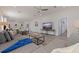 Open-concept living room with a large sectional sofa, modern decor, and a seamless flow to the dining area at 2150 43Rd N Ter, St Petersburg, FL 33714
