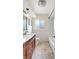 Bathroom features vanity, a shower-tub combo, and neutral color palette at 3065 Merrill Ave, Clearwater, FL 33759