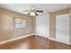 This bedroom has laminate wood floors, ceiling fan, fresh paint and a closet at 3065 Merrill Ave, Clearwater, FL 33759