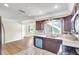 Inviting kitchen features wood cabinets, granite counters, and stainless steel appliances at 3065 Merrill Ave, Clearwater, FL 33759