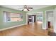 Open floor plan showcasing the hardwood floors between the living room and kitchen at 3065 Merrill Ave, Clearwater, FL 33759