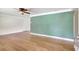 A view of the neutral-colored living room with hardwood floors at 3065 Merrill Ave, Clearwater, FL 33759