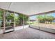 Outdoor porch with a tiled floor, screened walls, and views of the backyard at 3065 Merrill Ave, Clearwater, FL 33759