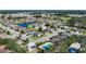Aerial view of the community showcasing the surrounding houses, ponds and mature trees at 3212 55Th E St, Palmetto, FL 34221