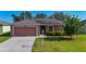 Charming single-story home with a well-manicured lawn and attached two-car garage at 3212 55Th E St, Palmetto, FL 34221