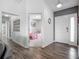 Hallway with views to bedrooms and living areas, enhanced by stylish wood flooring at 3212 55Th E St, Palmetto, FL 34221