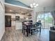 Open-concept kitchen with modern appliances, an eat-in area, and hardwood floors at 3212 55Th E St, Palmetto, FL 34221