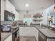 Bright kitchen featuring granite countertops, stainless appliances, and bar shelves at 3212 55Th E St, Palmetto, FL 34221