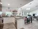 Open kitchen and living room, with dining area and island with seating at 3212 55Th E St, Palmetto, FL 34221