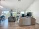 Spacious living room featuring ample seating, neutral decor, and lots of natural light at 3212 55Th E St, Palmetto, FL 34221