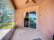 Screened patio with a ceiling fan and sliding glass doors leading to the interior at 3212 55Th E St, Palmetto, FL 34221
