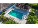 Aerial view of the community pool area, including lounge chairs and lush landscaping at 3212 55Th E St, Palmetto, FL 34221