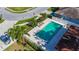 Aerial view of the community pool surrounded by lounge chairs and landscaped gardens at 3212 55Th E St, Palmetto, FL 34221