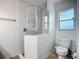 Clean bathroom featuring an updated glass enclosed corner shower and a toilet at 3212 55Th E St, Palmetto, FL 34221