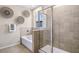 Modern bathroom with a soaking tub, separate shower, and neutral tile at 32450 Osprey Peak Way, San Antonio, FL 33576