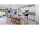 Bright kitchen with stainless steel appliances, granite countertops, and ample cabinet space at 32450 Osprey Peak Way, San Antonio, FL 33576