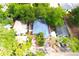 Aerial view of a home featuring mature trees and a fenced yard at 3306 E Chelsea St, Tampa, FL 33610